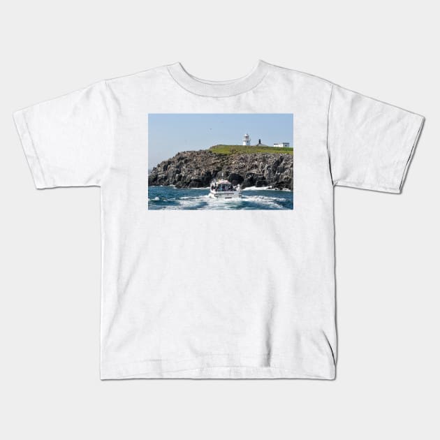 Tour boat visiting the bird colonies on the Farne Islands, Northumberland, UK Kids T-Shirt by richflintphoto